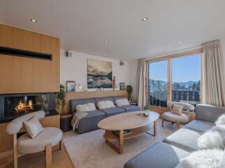 Experience luxury living in this stunning property, featuring a cozy fireplace and a modern, open-plan design.