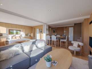 Experience luxury living in this stunning property, featuring a seamless blend of modern design and natural elements.