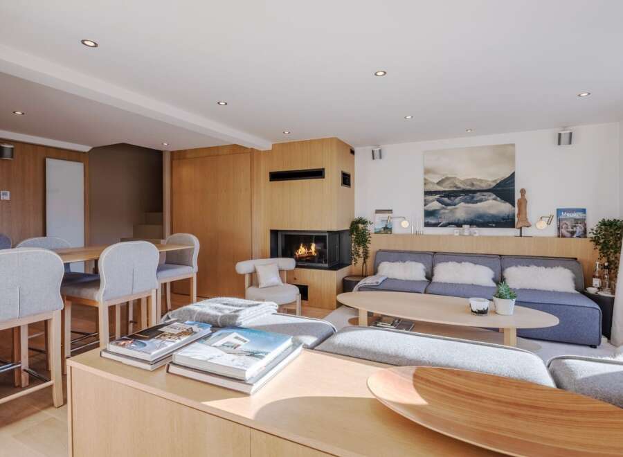 Experience luxury living in this stunning property, featuring a cozy fireplace and a modern, open-concept design.