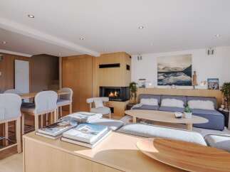 Experience luxury living in this stunning property, featuring a cozy fireplace and a modern, open-concept design.
