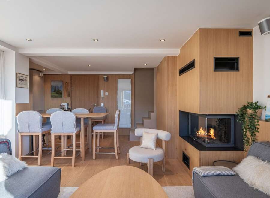 Experience luxury living in this stunning property featuring a cozy fireplace, perfect for chilly evenings.