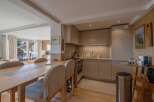 This stunning property boasts a modern kitchen with sleek cabinetry and stainless steel appliances, perfect for culinary enthusiasts.