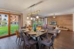 Experience luxury living in this stunning property, featuring a spacious dining area perfect for entertaining.