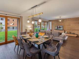 Experience luxury living in this stunning property, featuring a spacious dining area perfect for entertaining.