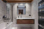 Experience luxury in this stunning bathroom featuring a sleek, modern design.