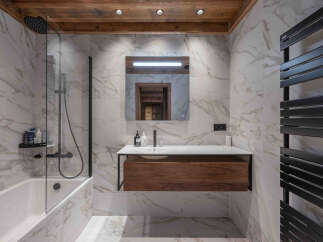 Experience luxury in this stunning bathroom featuring a sleek, modern design.
