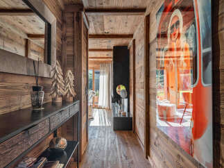 Step into rustic elegance with this stunning property, showcasing a beautifully designed wooden hallway.