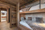 This stunning property features a cozy bedroom with custom-built bunk beds, perfect for accommodating guests or family.