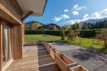 Enjoy the tranquility of this stunning property, featuring a beautifully crafted wooden deck perfect for outdoor relaxation.