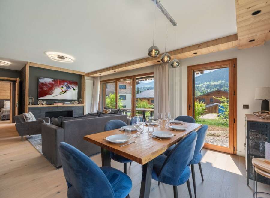 Experience luxury living in this stunning property, featuring a spacious dining area perfect for entertaining.