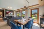 Experience luxury living in this stunning property, featuring a spacious dining area perfect for entertaining.