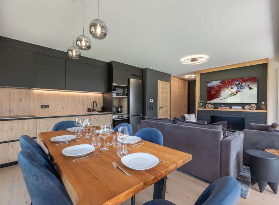 Experience luxury living in this stunning property featuring a modern kitchen with sleek cabinetry and a spacious dining area perfect for entertaining.