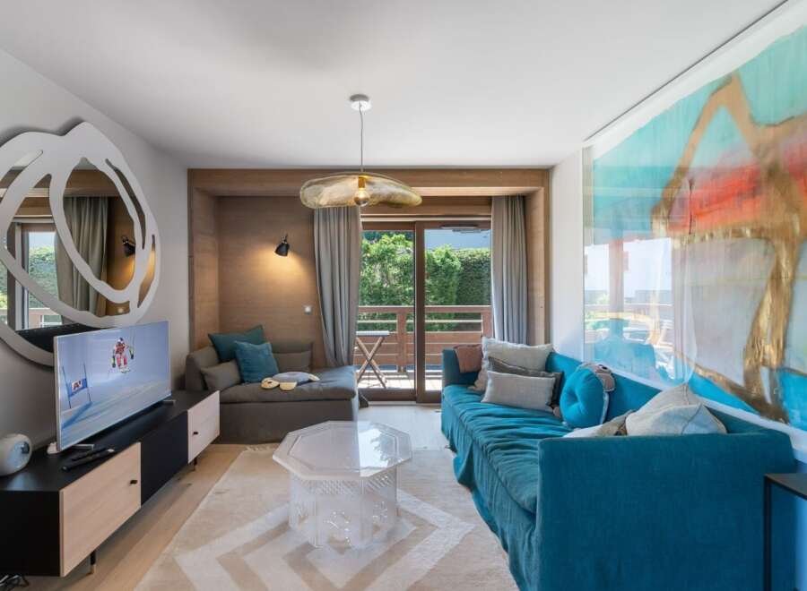 Experience luxury living in this stunning property, featuring a beautifully designed living room with a modern aesthetic.