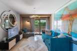 Experience luxury living in this stunning property, featuring a beautifully designed living room with a modern aesthetic.