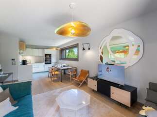 Discover modern living in this stunning property! Featuring a bright and airy open-plan layout, this home boasts a sleek kitchen, a cozy living area, and a stylish dining space.