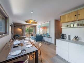 Experience luxury living in this stunning property, featuring a beautifully designed dining area perfect for entertaining.