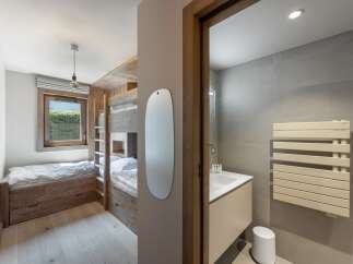 This stunning property boasts a modern design with a focus on natural materials.