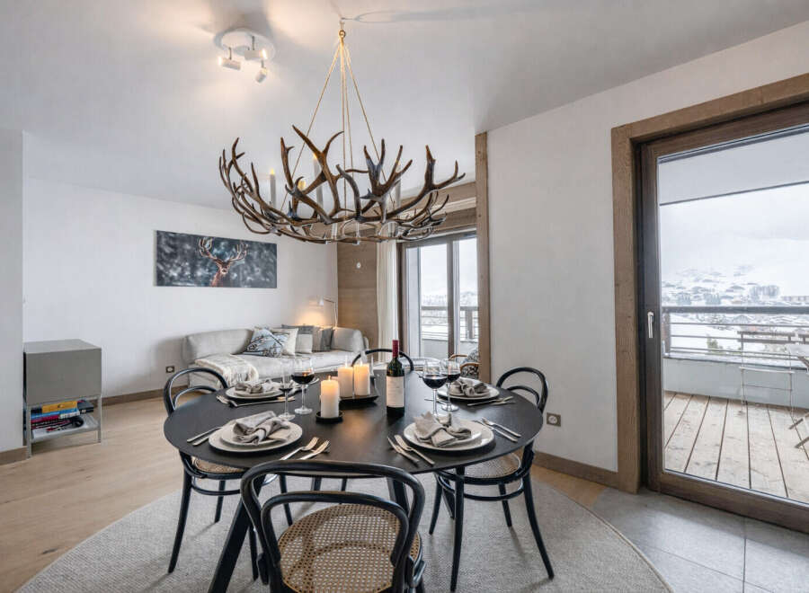 Experience luxury living in this stunning property, featuring a beautifully designed dining area perfect for entertaining.