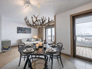 Experience luxury living in this stunning property, featuring a beautifully designed dining area perfect for entertaining.