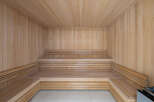 Step into relaxation with this stunning sauna, a perfect addition to any luxury home.