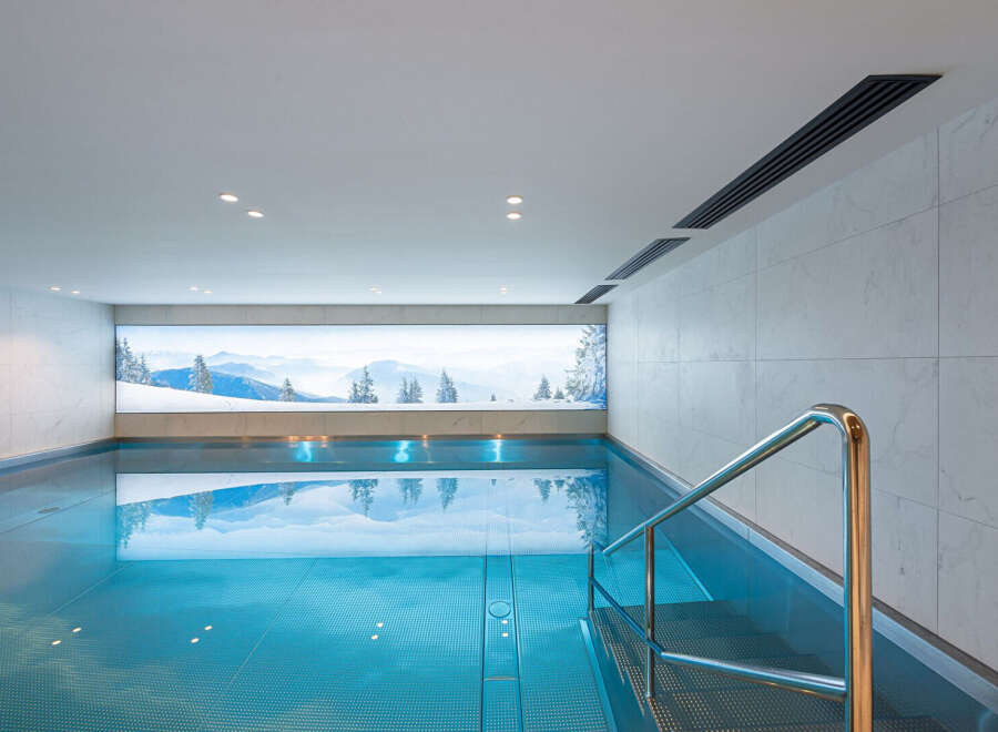 Experience tranquility in this stunning indoor pool, perfect for relaxation and wellness.
