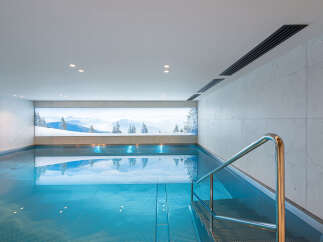 Experience tranquility in this stunning indoor pool, perfect for relaxation and wellness.