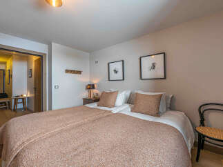 This cozy bedroom offers a warm and inviting atmosphere, perfect for relaxation.