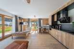 This stunning property boasts a modern kitchen with sleek appliances and ample storage, perfect for culinary enthusiasts.