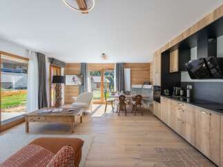 This stunning property boasts a modern kitchen with sleek appliances and ample storage, perfect for culinary enthusiasts.