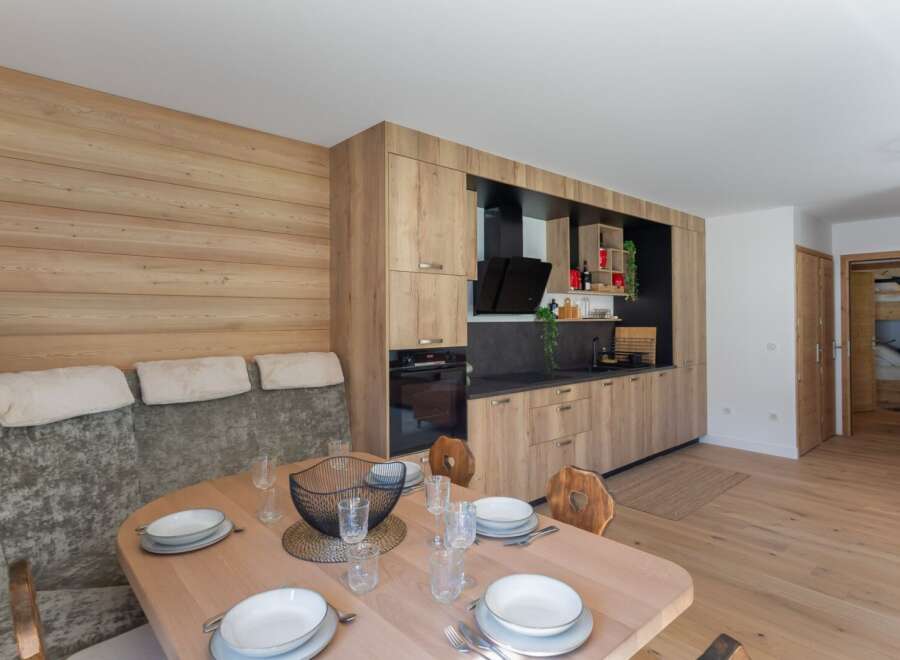 Discover modern living in this stunning property featuring a beautifully designed kitchen with sleek cabinetry and a dining area perfect for entertaining.