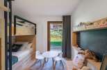 This charming children's bedroom features a cozy bunk bed, perfect for siblings or sleepovers.