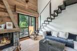 This stunning property boasts a cozy living room with a fireplace, perfect for relaxing evenings.
