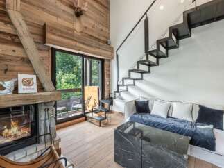 This stunning property boasts a cozy living room with a fireplace, perfect for relaxing evenings.