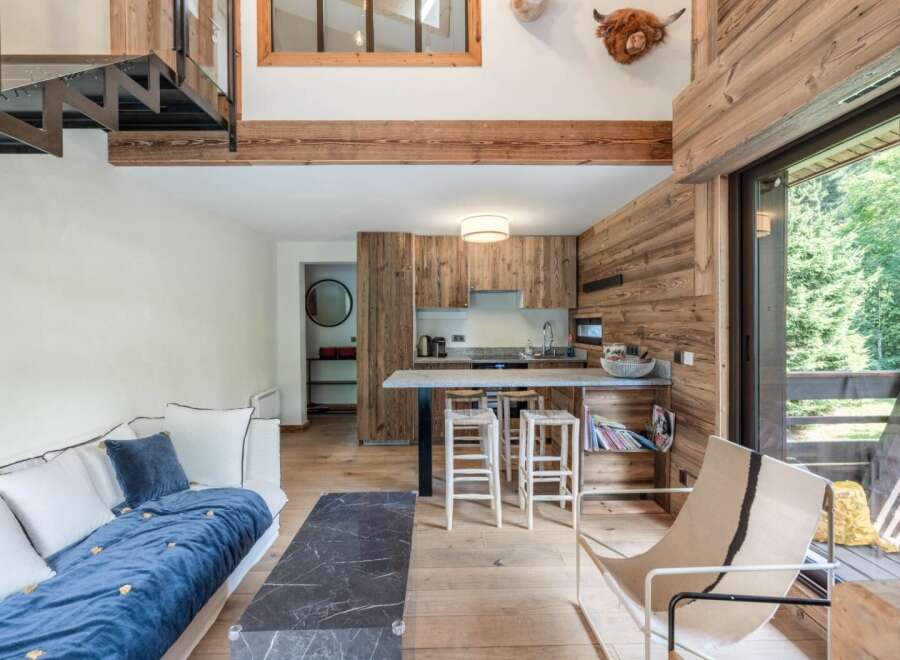 Discover the charm of this stunning property, featuring a beautifully designed interior with rustic wooden accents and modern amenities.