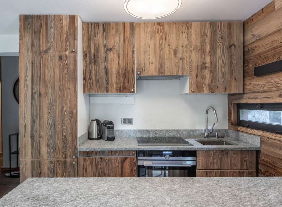 This stunning kitchen boasts a rustic charm with its beautiful wooden cabinetry and countertops.