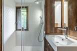 This stunning bathroom features a modern design with a touch of rustic charm.