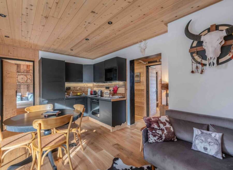 Discover the charm of this cozy property, featuring a stylish kitchen with modern appliances and a dining area perfect for gatherings.
