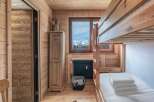 Step into this cozy mountain retreat, featuring a charming bunk bed perfect for family or guests.