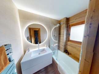 Step into this beautifully designed bathroom featuring a modern aesthetic and luxurious finishes.