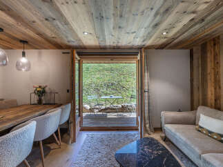 Step into a cozy retreat with this stunning property, featuring a seamless blend of rustic charm and modern comfort.