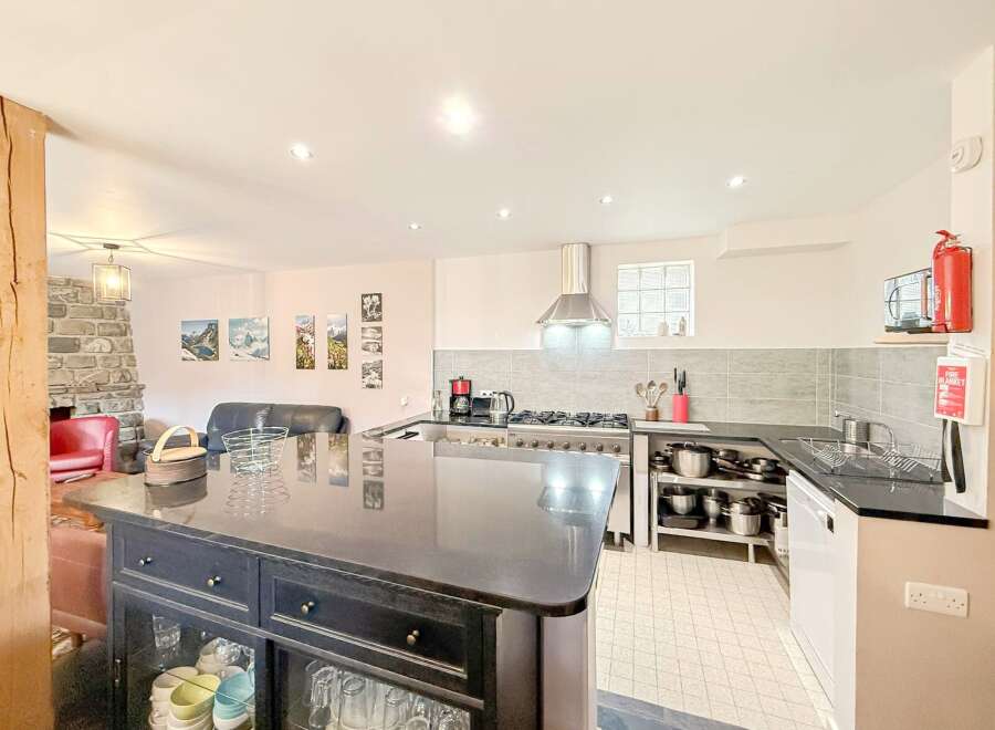 This stunning kitchen boasts a sleek, modern design with a large island perfect for meal preparation and entertaining.