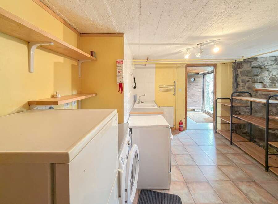 Discover the charm of this unique property, featuring a functional kitchen area.