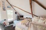 Discover the charm of this cozy living space, perfect for relaxing after a day of exploring.
