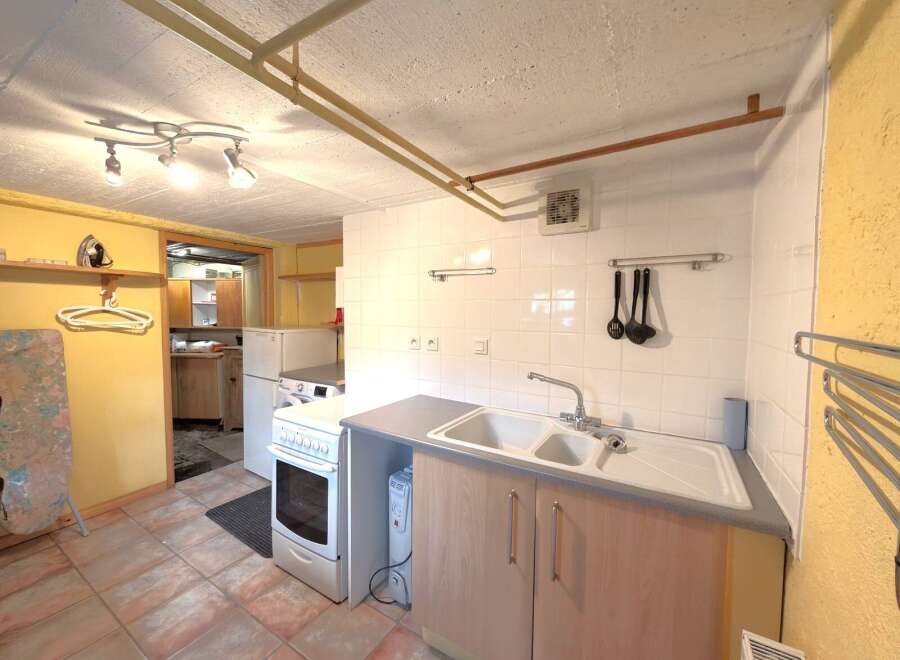 Discover this charming kitchen space, perfect for culinary enthusiasts.