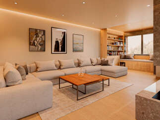 Experience luxury living in this stunning property, featuring a spacious living room with a modern sectional sofa and a cozy fireplace.