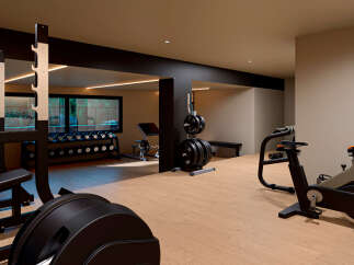 This modern gym offers a comprehensive workout experience with a variety of equipment.