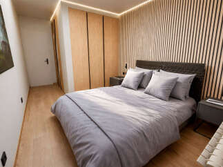 This modern bedroom boasts a stylish design with a focus on natural elements.