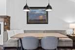 Enjoy cozy meals in this charming dining area featuring a comfortable banquette seating arrangement.