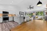 Experience modern living in this open-concept home featuring a sleek, updated kitchen with stainless steel appliances and ample cabinet space.