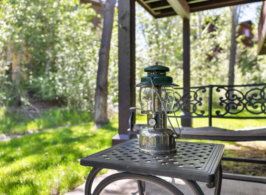 Enjoy the serene outdoor living spaces of this property, featuring a charming covered patio perfect for relaxation.